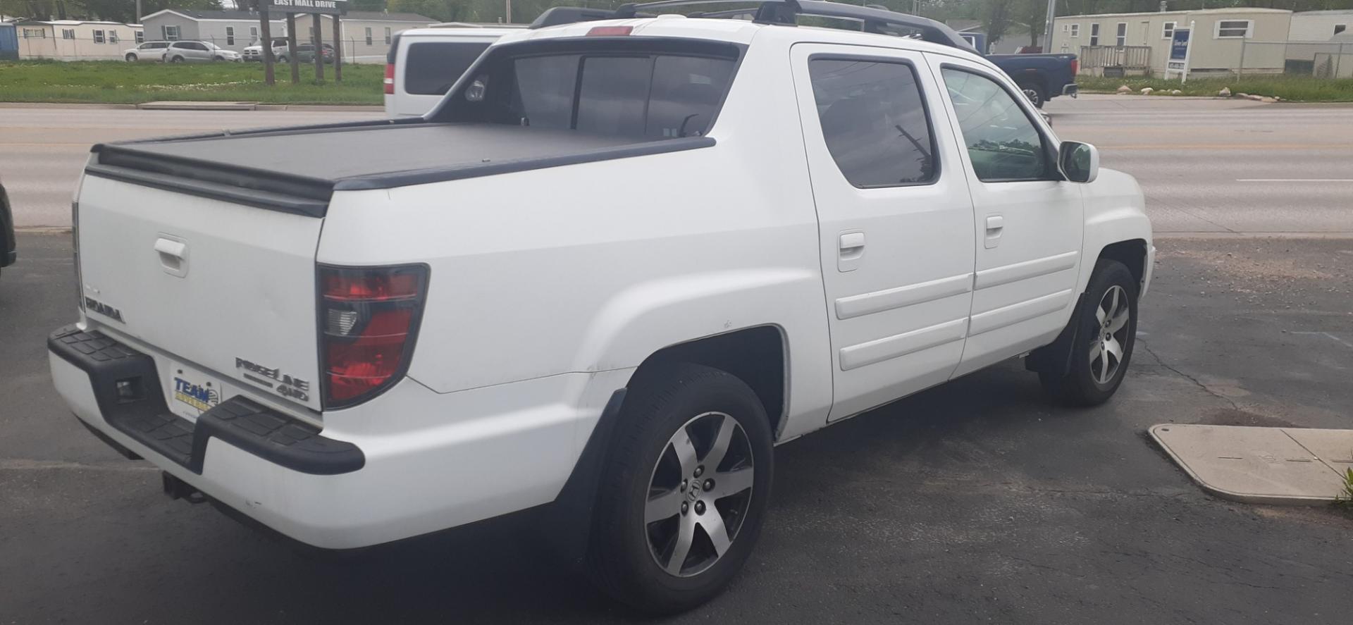 2014 Honda Ridgeline RTL-S (5FPYK1F67EB) with an 3.5L V6 SOHC 24V engine, 5-Speed Automatic transmission, located at 2015 Cambell Street, Rapid City, SD, 57701, (605) 342-8326, 44.066433, -103.191772 - Photo#3